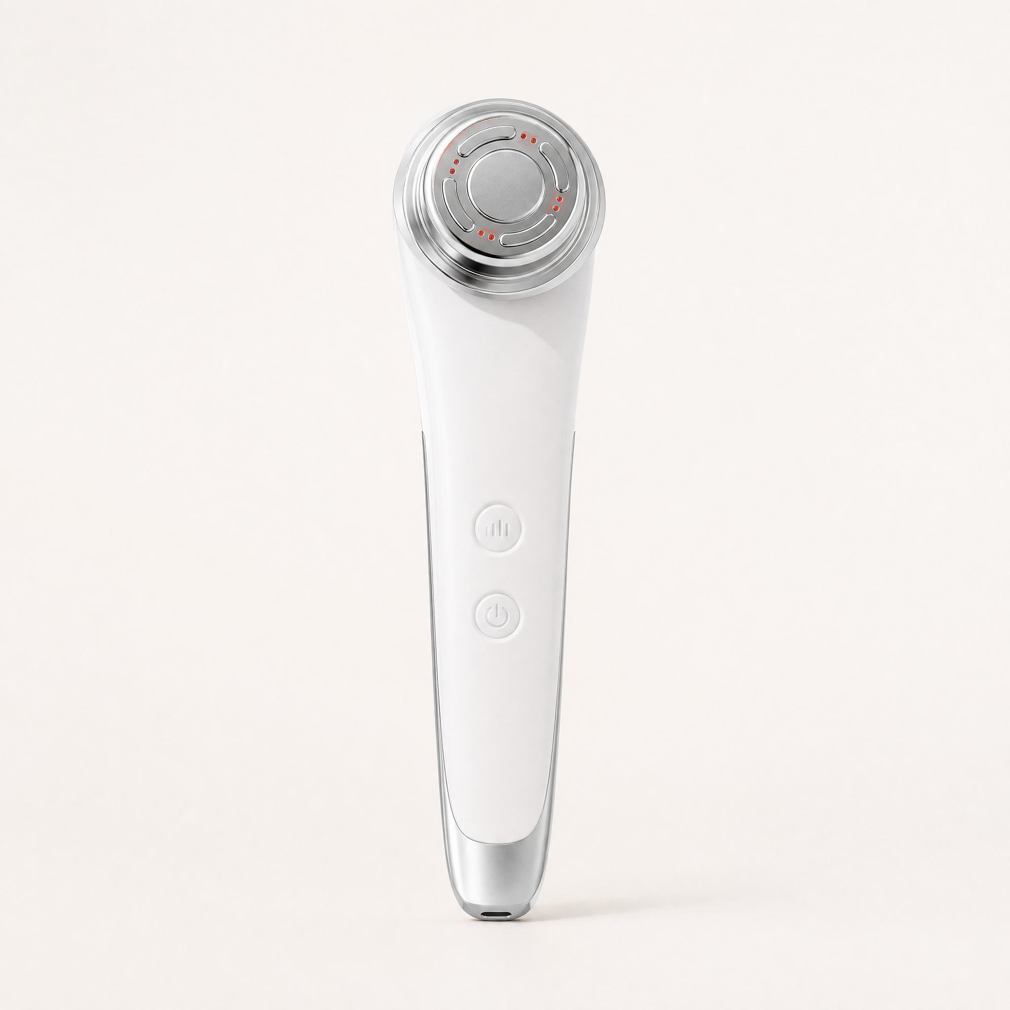 Tessora Facial Massager in white on a soft off-white background