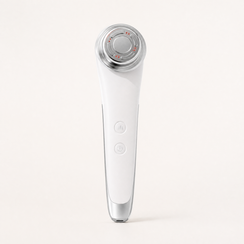 Tessora Facial Massager in white on a soft off-white background