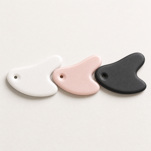 Tessora Ceramic Gua Sha Tool in white, pink and black