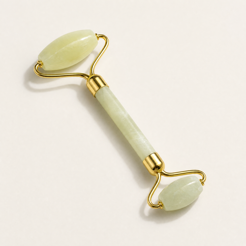 Tessora Jade Facial Roller with gold hardware on a soft off-white background