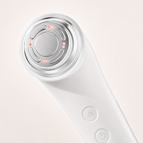 Close-up of the Tessora Facial Massager metal massage head and controls
