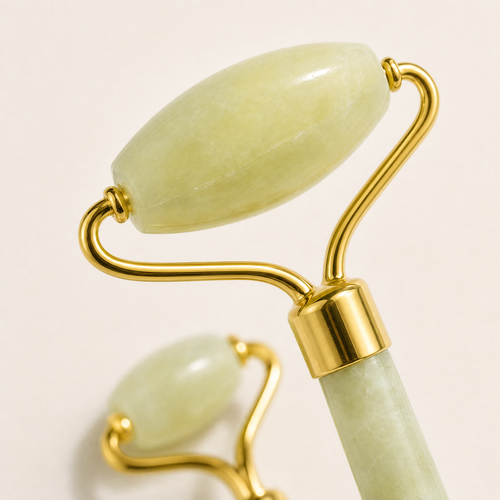 Close-up of the Tessora Jade Facial Roller stone head and gold mount